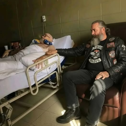 At 73, dying of lung cancer, I lay in hospice with no visits from my three kids for six months. I was completely alone. Then Marcus, a tattooed biker, accidentally walked in. Seeing my Purple Heart, he stayed, called me “brother,” and listened as I told him how my kids had abandoned me. He leaned close: “I can’t make them love you, but I can make them regret it. You in?” I nodded — and for the first time in months, I smiled. (check in the first comment👇)