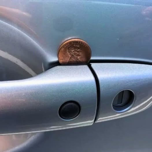 I parked my car earlier today. When I returned, a coin was stuck in the passenger door handle. Something felt off — what does it mean? (Check In First comment👇)